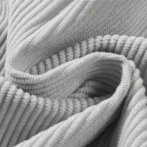 Detailed close-up showing the soft ribbed texture and fine pile of corduroy fabric.