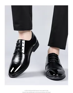 Close-up of men's black patent leather business shoes with elegant lace-up design