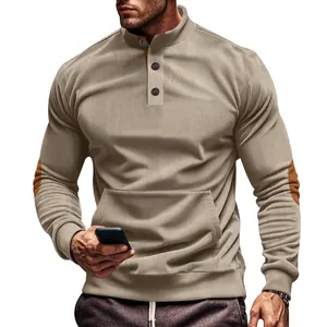 Detail of men's khaki corduroy sweatshirt with button collar and kangaroo pocket