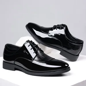 Classic glossy black pointed-toe men's business dress shoes with elegant lace-up closure
