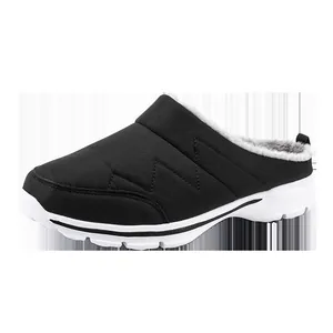 Cozy black winter mule slipper featuring warm grey faux fur lining and white sole