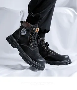 Detail shot of men's black suede high-top Martin boots with durable rubber sole