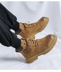 Detailed view of men's vintage brown leather Martin boots with heavy rubber soles