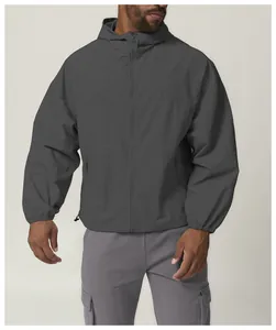 Detailed view of a grey hooded outdoor windbreaker jacket perfect for men's citywalk
