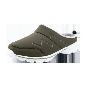 Close-up of warm winter mule shoes with grey fleece lining and zigzag stitching