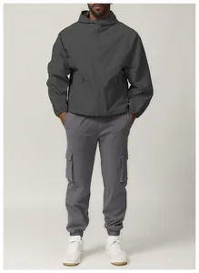Detail view of a men's dark grey windproof hooded jacket for outdoor citywalk.