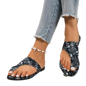 Women's skull print flip-flop sandals for summer beach wear with comfortable flat soles