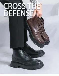 Detail view of retro men's Martin boots in black and brown leather textures
