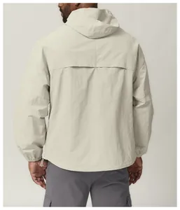 Back view of a men's lightweight hooded windbreaker jacket in light beige for hiking.