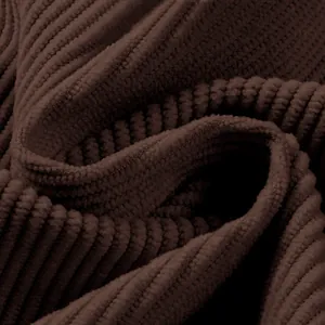 Macro view of brown corduroy material showing distinct vertical ribbed fabric texture