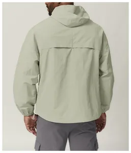 Sage green hooded windbreaker jacket back view showing waterproof technical fabric