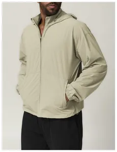 Detailed side view of a men's stylish beige hooded water-repellent windbreaker jacket