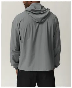 Detailed back view of a grey men's water-repellent hooded outdoor windbreaker jacket