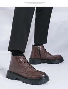 Detailed view of men's brown leather Martin boots with thick black lug soles.