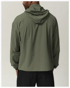 Detail back view of men's olive green water-repellent hooded outdoor windbreaker jacket