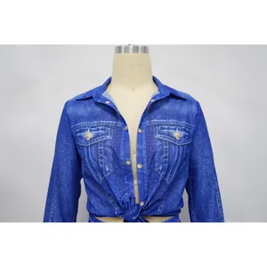 Close-up detail of a women's chiffon top featuring a realistic blue denim print design