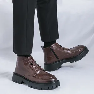 Classic brown leather men's high top Martin boots with chunky black sole and side zipper