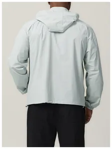 Back view of men's lightweight water-repellent hooded windbreaker jacket in grey