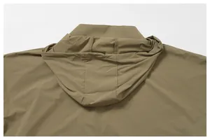 Rear detail view of the hood on a khaki water-repellent men's windbreaker jacket