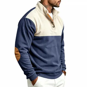 Close-up of men's corduroy sweatshirt featuring color blocking and button stand collar.
