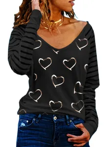 Close-up detail of women's heart print long sleeve V-neck T-shirt with striped sleeves