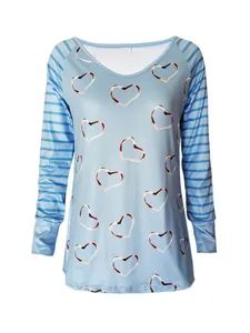 Close-up of a light blue long sleeve t-shirt with heart print and striped sleeves