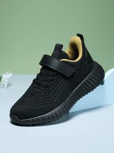 Breathable black mesh kids sneaker with velcro strap and yellow lining details