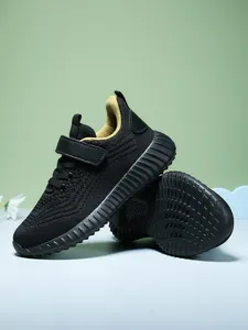 Close-up of breathable mesh children's sneakers with anti-slip textured sole