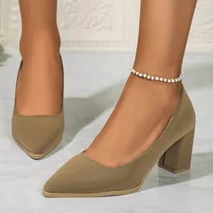 Detailed view of khaki pointed toe pumps with French-style block heels for work