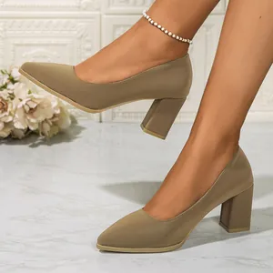 Elegant khaki pointed toe chunky heel pumps worn with an anklet for office style