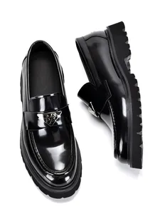 Detailed shot of black patent leather loafers for men featuring a thick platform sole