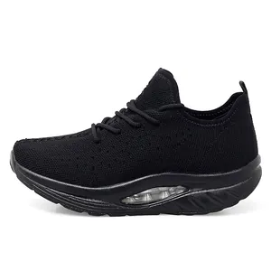 Detailed side profile of black flyknit rocker walking shoes for women with thick cushioned sole.