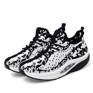 Breathable knit rocker walking shoes for women in a stylish black and white contrast pattern
