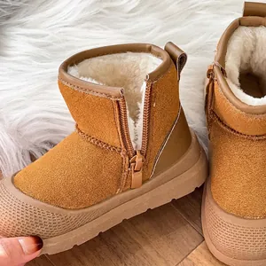 Detailed view of kids' winter snow boots with warm plush lining and side zipper