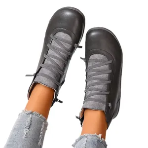 Women's dark grey flat high-top casual ankle boots with cross-strap detail