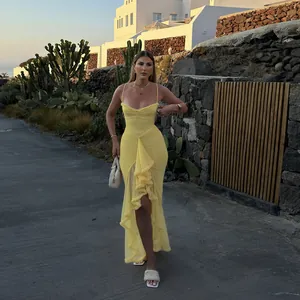Full body view of an elegant yellow mesh camisole maxi dress with ruffle detailing