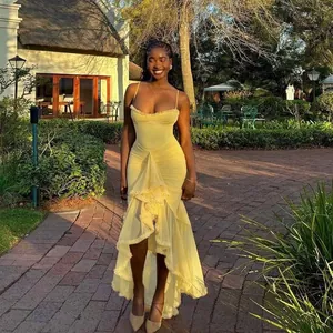 Elegant yellow mesh spaghetti strap maxi dress featuring a romantic ruffled high-low hemline