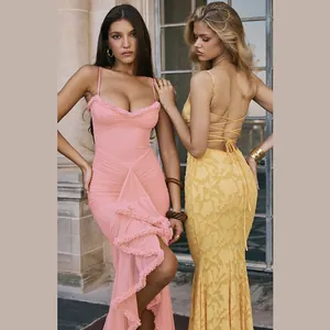 Detail shot of two models wearing sexy backless mesh camisole maxi dresses in pink and yellow