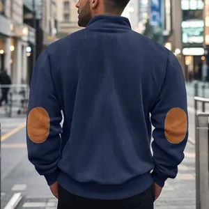 Rückenansicht eines schweren marineblauen Cord-Sweatshirts mit braunen Ellbogen-Patches.