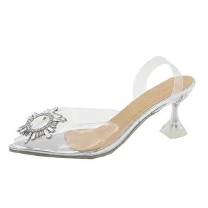 Sandales élégantes en PVC transparent avec ornement en strass et talon cristal