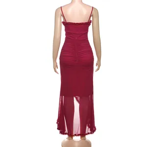 Back view of burgundy mesh camisole maxi dress showing ruched detail and ruffles.