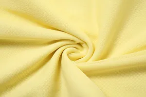 Close-up of yellow breathable mesh fabric texture for elegant slim-fit dresses.