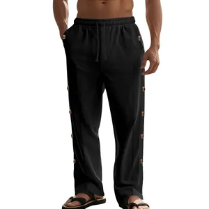 Vue détaillée du pantalon en lin noir pour homme avec cordon et boutons latéraux