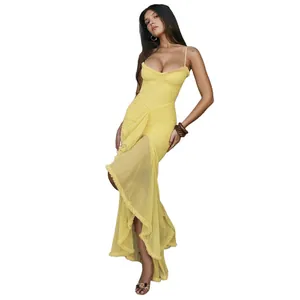 Detailed view of a sexy yellow mesh slip long dress with ruffles and open back design