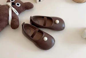 Elegant dark brown girls Mary Jane flats featuring a classic pearl accent on the toe