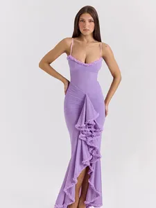 Elegant purple mesh maxi dress featuring a ruched bodice and ruffled asymmetrical hem.