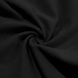 Close-up detail showing the breathable black linen fabric texture of men's casual pants.