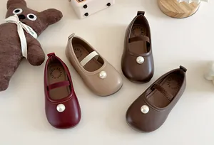 Close-up of girls' pearl Mary Jane shoes in burgundy beige and brown leather options