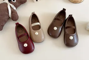 Elegant toddler girls pearl Mary Jane shoes in multiple colors on a warm background