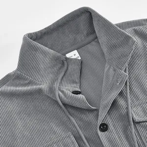 Macro detail view of a gray corduroy vintage jacket collar and buttons with size M tag